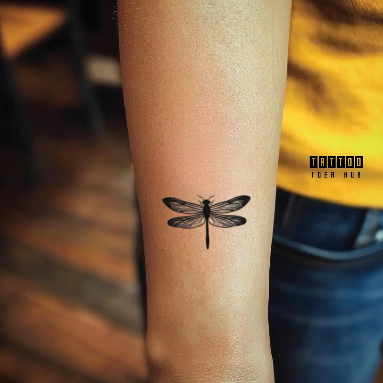 small dragonfly forearm temporary tattoo idea design