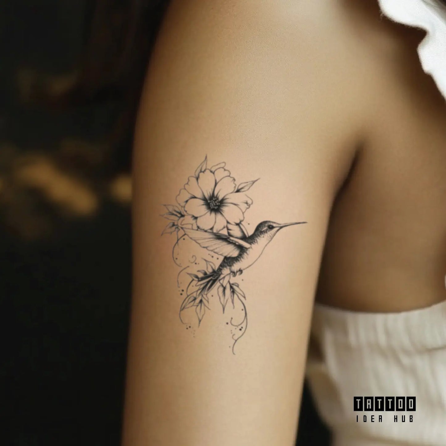 hummingbird and flower bicep temporary tattoo idea design