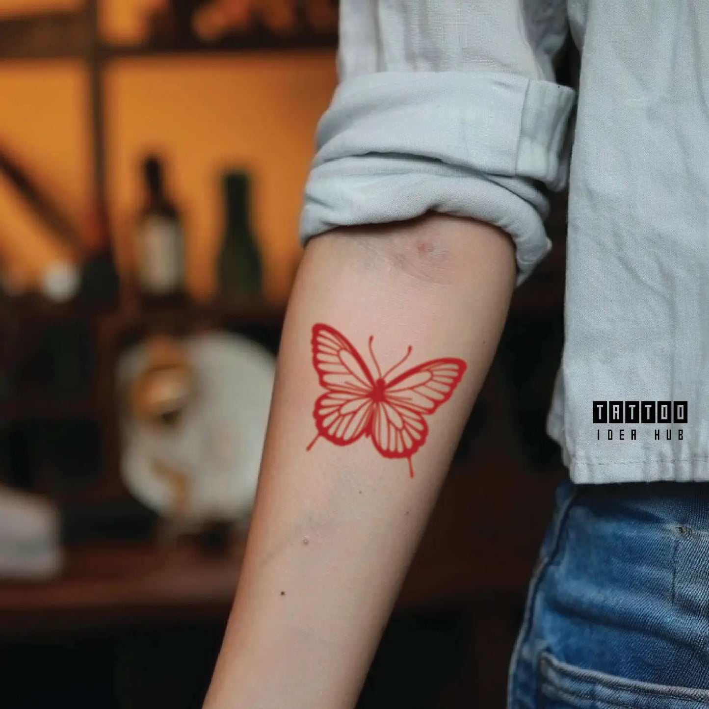 red butterfly forearm temporary tattoo idea design