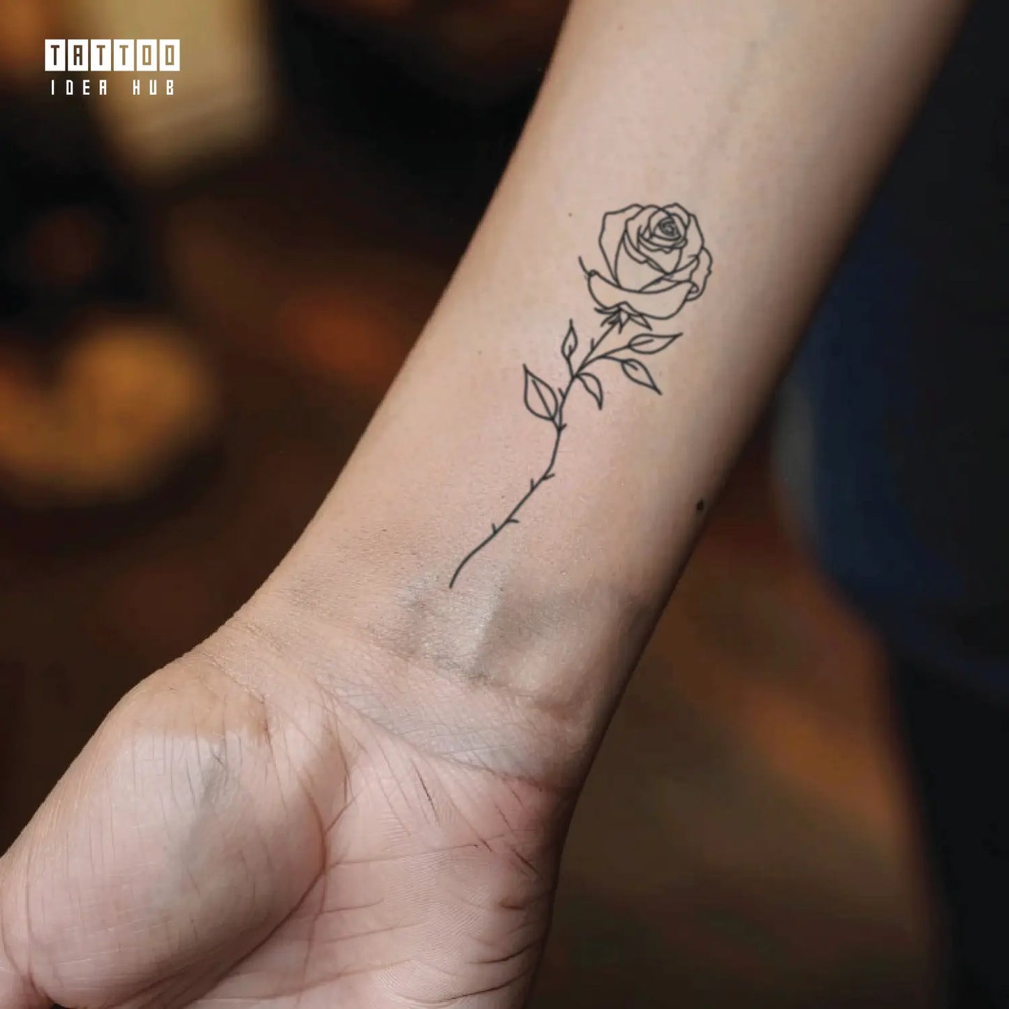 rose outline wrist temporary tattoo idea design