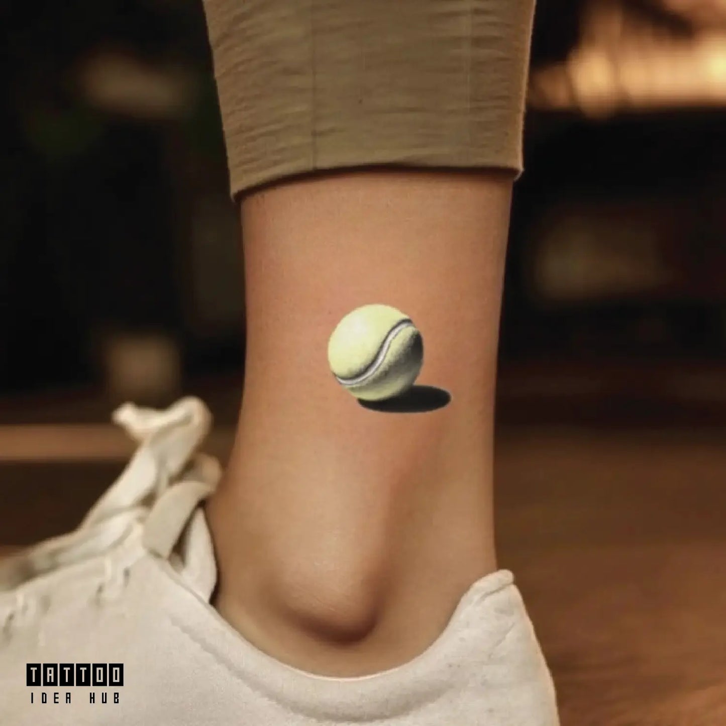 simple realistic tennis ball ankle temporary tattoo idea design