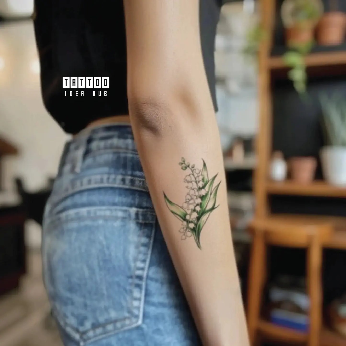 minimalist lily of the valley flower forearm temporary tattoo idea design