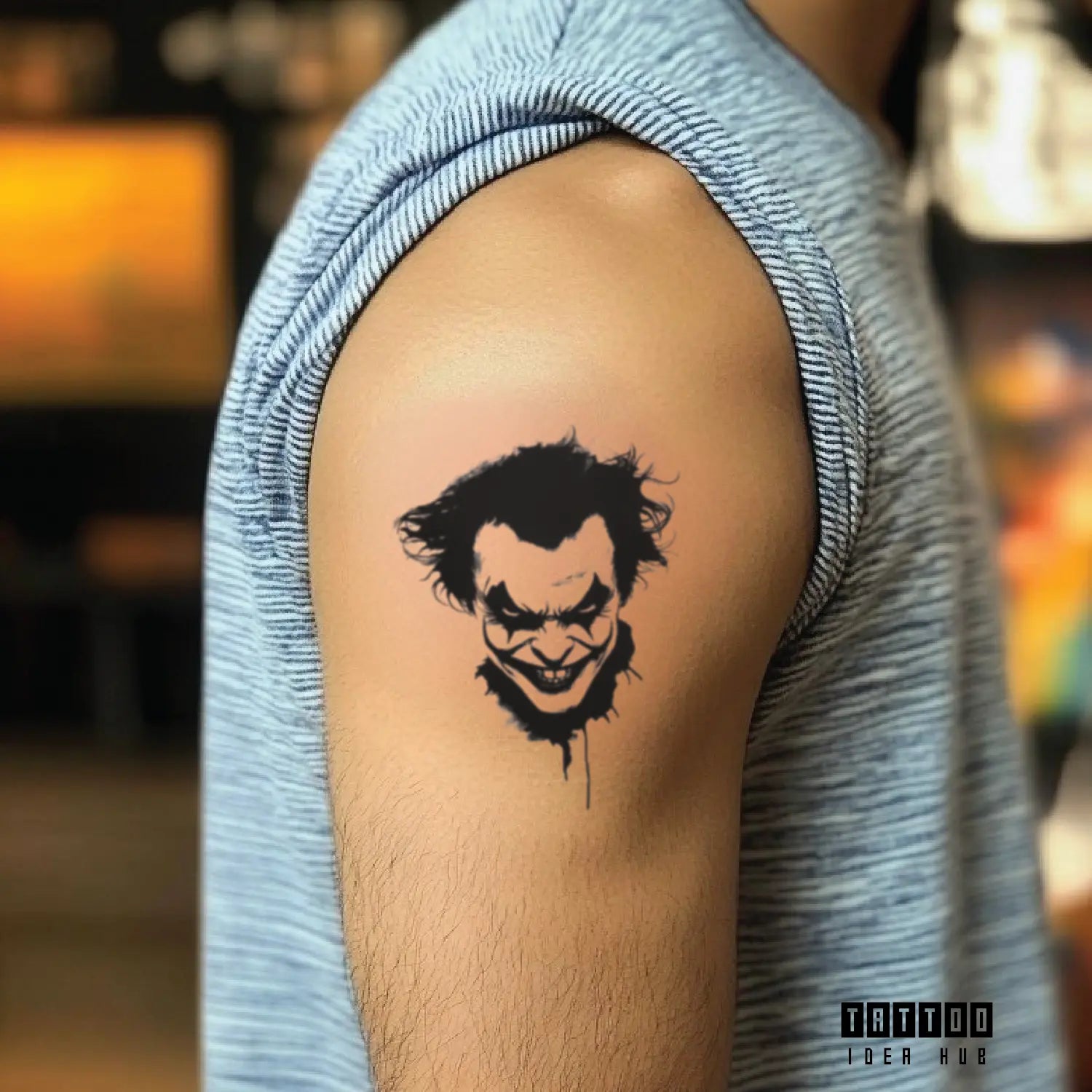 black and white joker bicep temporary tattoo idea design